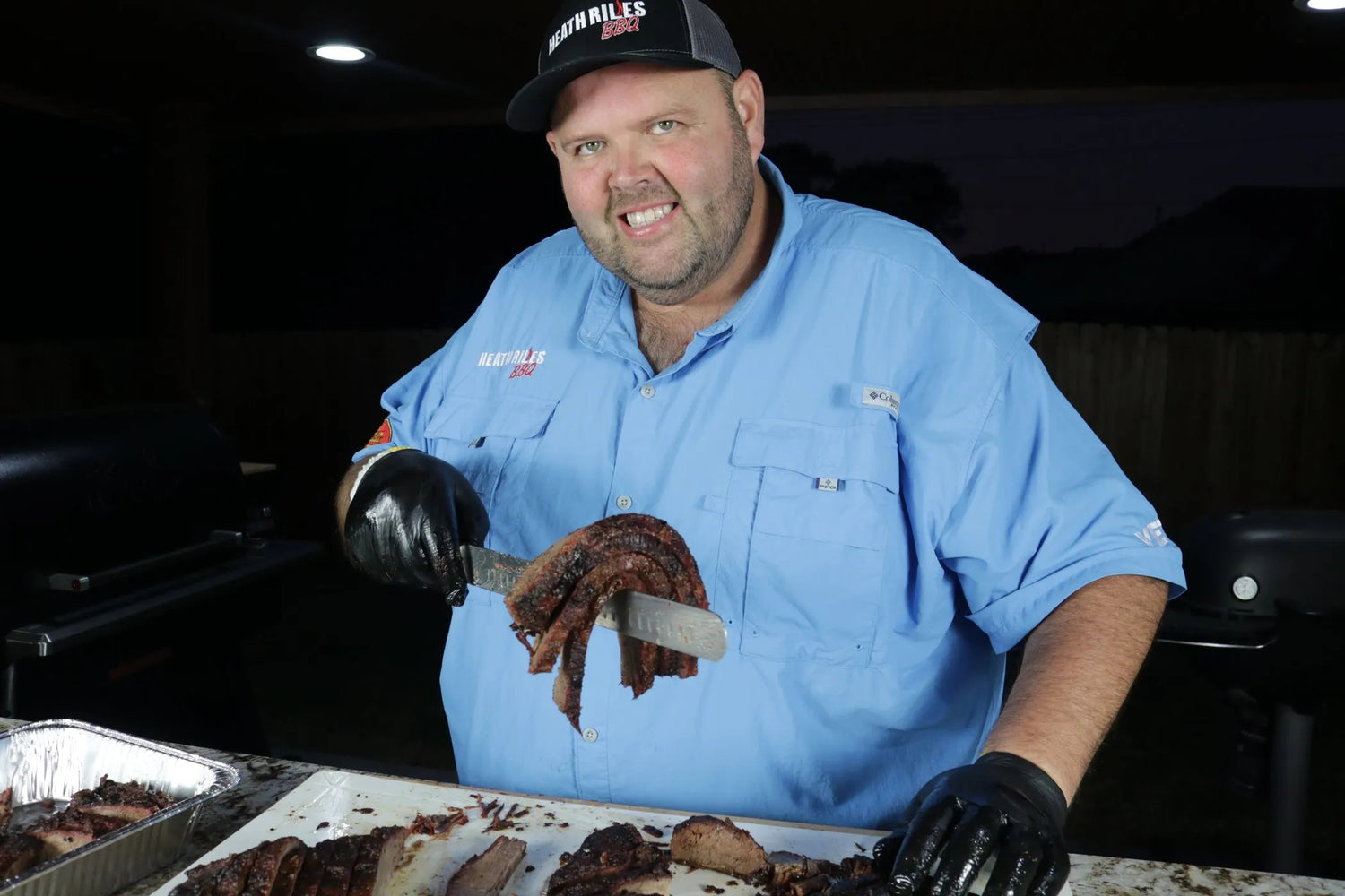 Pic of Heath Riles holding some Brisket